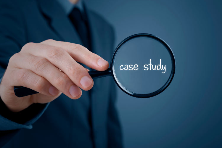 Businessman holding magnifying glass highlighting the words 'case study' to represent real-world business analysis and research insights